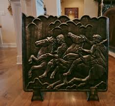 Parafiamma in bronzo con raffigurazione equestre